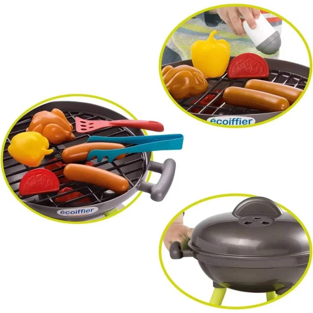 Toy BBQ grill with colorful food pieces plus spatula and tong accessories on grate