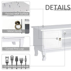 White cabinet corner detail with metal ring handles, curved pine legs, and cable hole
