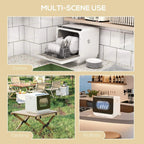 White countertop dishwasher on counter with open door and dish rack
