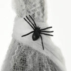 Black spider decoration on grey mummy’s spider web wrap