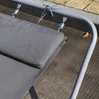 Grey rocking lounger seat with corner cushion and spring-connected metal frame