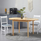 Natural wood drop-leaf dining table with two chairs in a compact kitchen dining setup