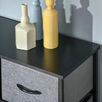 Grey fabric top drawer with curved black handle on a black-framed dresser