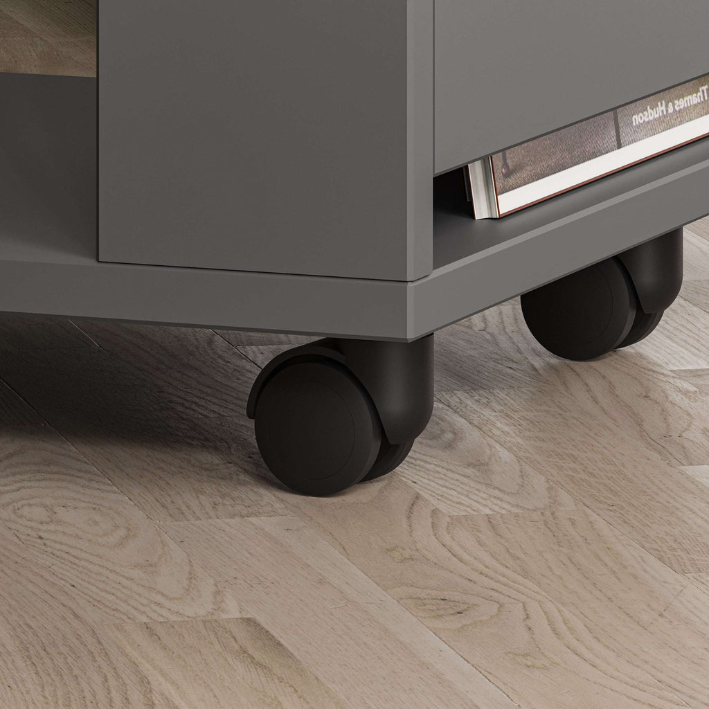 Dark gray side table with open shelf and rounded black rolling casters