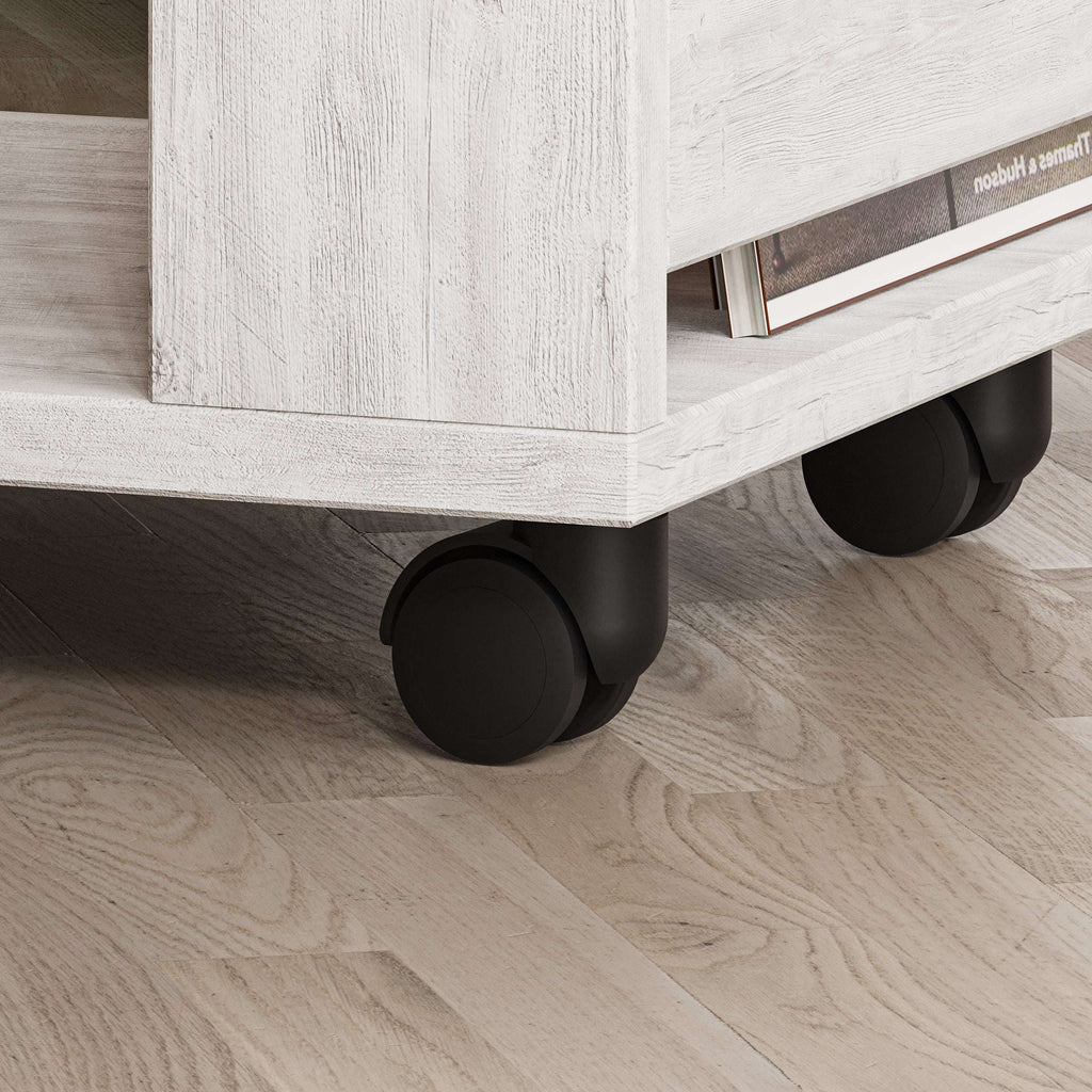 Grey side table with rounded caster wheels and open lower shelf corner