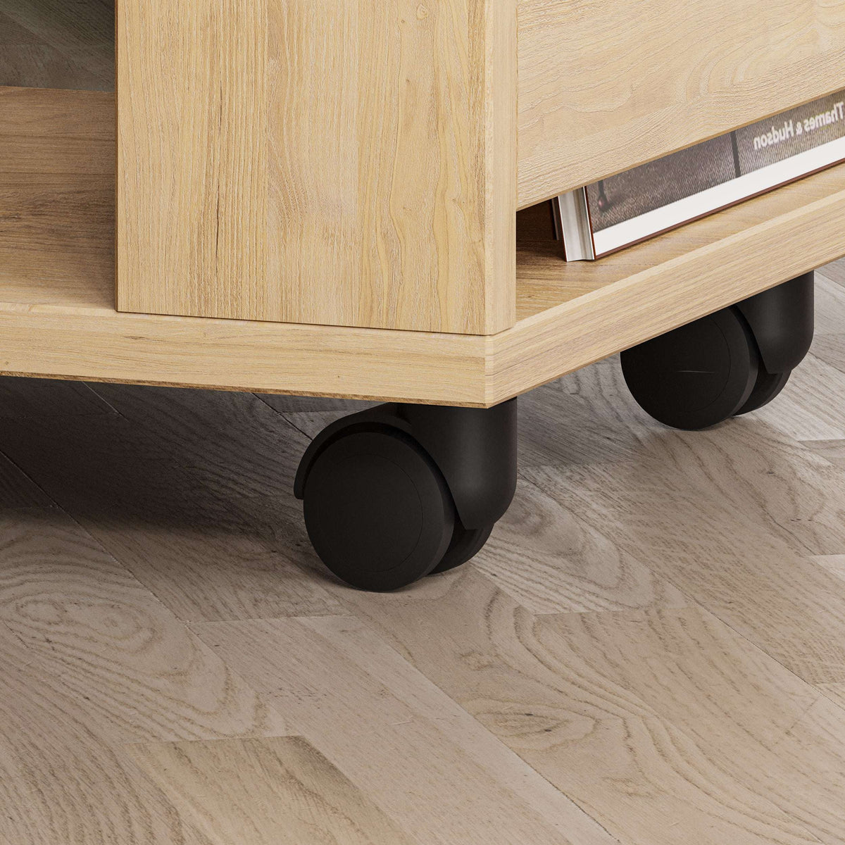 Light oak side table with rounded caster wheels and open lower shelf