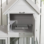 Light grey PawHut rabbit house with open front panel and interior nesting space