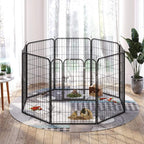 Black metal puppy playpen enclosure with door and small dog resting inside.