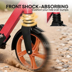 Front shock-absorbing red and black kick scooter fork with orange wheel