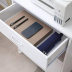 Open slide-out drawer in a white printer cabinet holding documents and accessories
