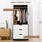 Black and white wardrobe with open doors showing hanging rail and three drawers