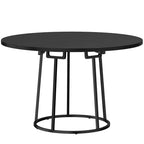 Round black dining table with pedestal-style conical metal base