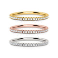 Three eternity stacking rings in yellow gold, rose gold, and silver with pavé stones