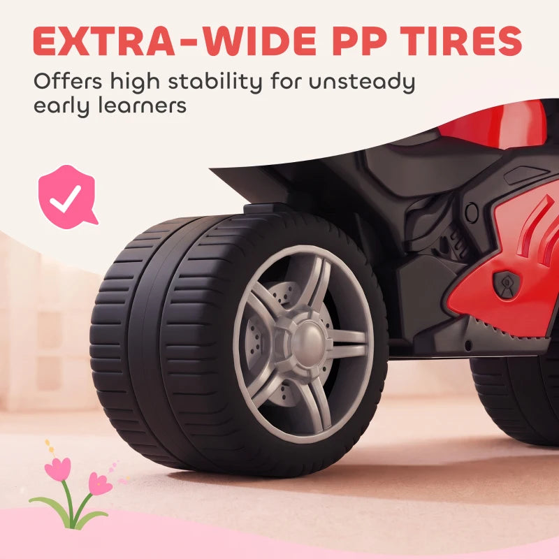 Extra-wide black tires on red and black toddler balance bike with sporty front fairing