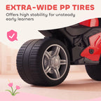 Extra-wide black tires on red and black toddler balance bike with sporty front fairing