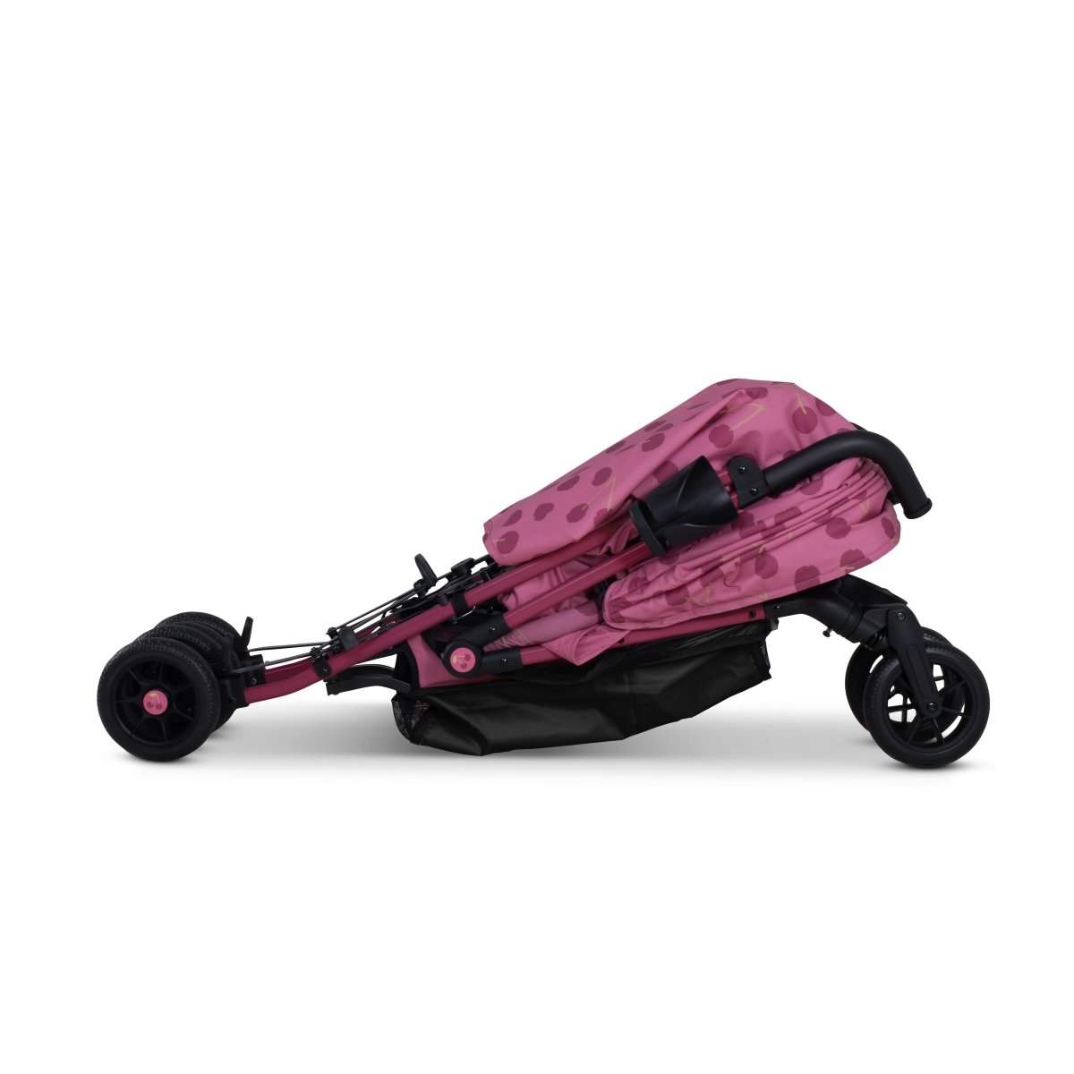 Cherry pink patterned stroller, side view with large rear wheels and foldable frame