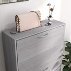 Grey wood-effect shoe cabinet with curved drawers and top surface for small items