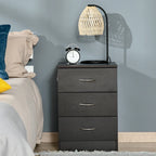 Black three-drawer bedside table with curved silver handles and flat top