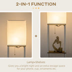 White floor lamp with fabric shade and side pull chain above three shelves