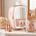 Pink mini skincare refrigerator with LED mirror showing cosmetics and bottles inside