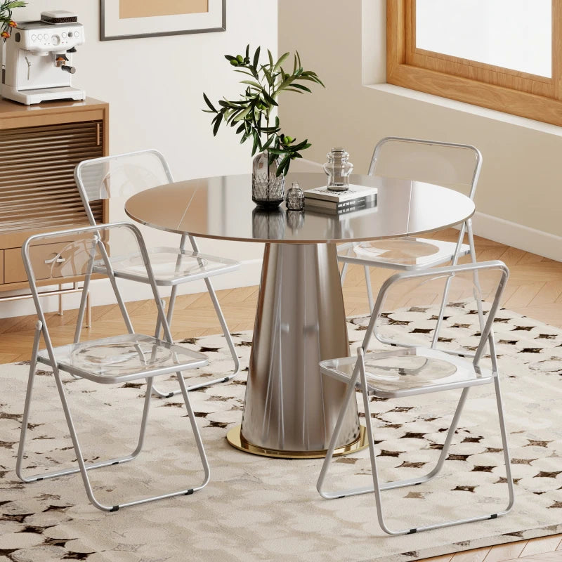 Clear folding dining chairs with transparent seats and backs, steel frames around a round table