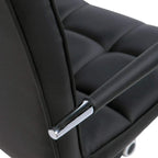 Black faux leather seat and back with chrome support arms on swivel desk chair