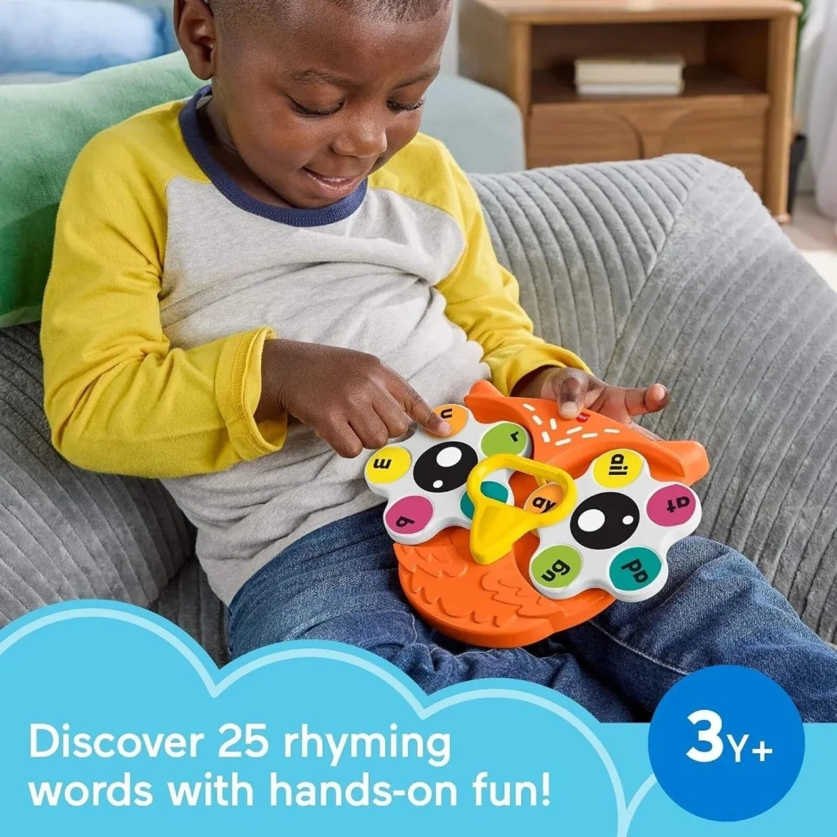Orange owl letter fidget spinner toy in a child’s hands