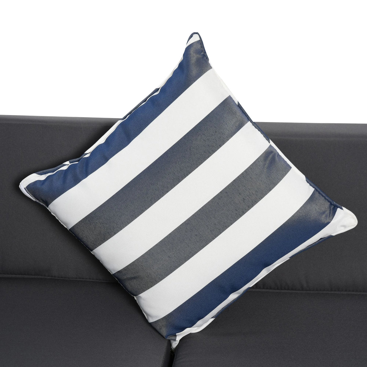 Blue and white striped cushion on a dark sofa seat