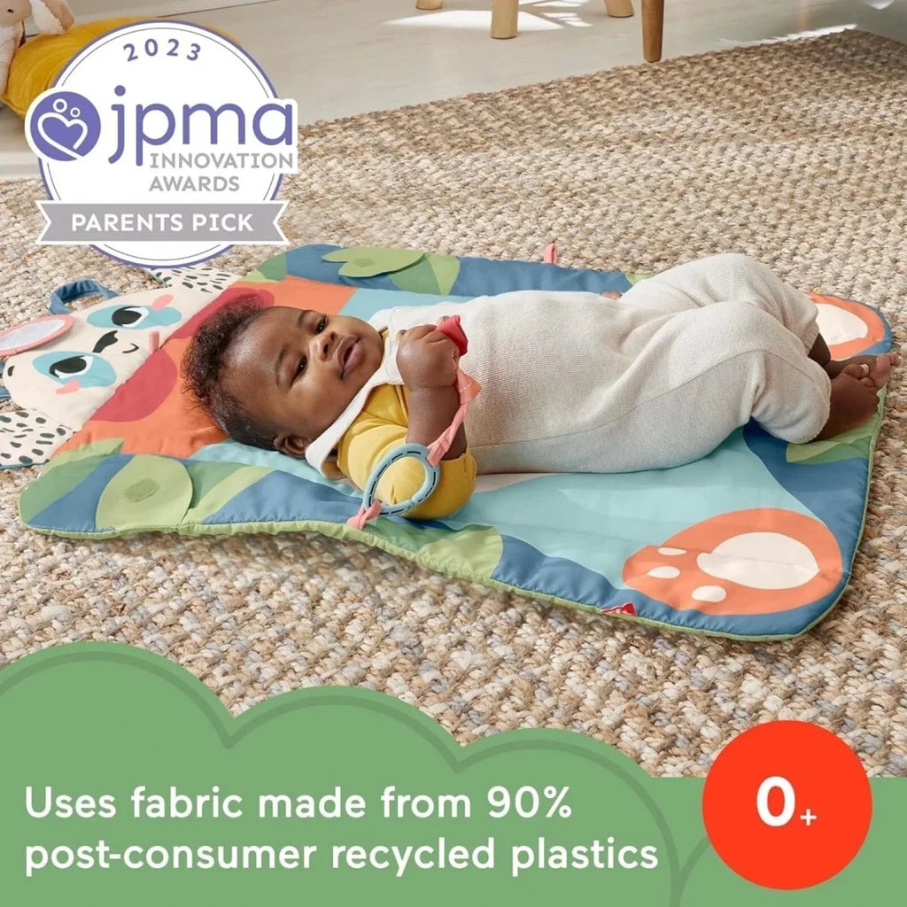 Baby playing on blue panda playmat with built-in toy links and soft panel