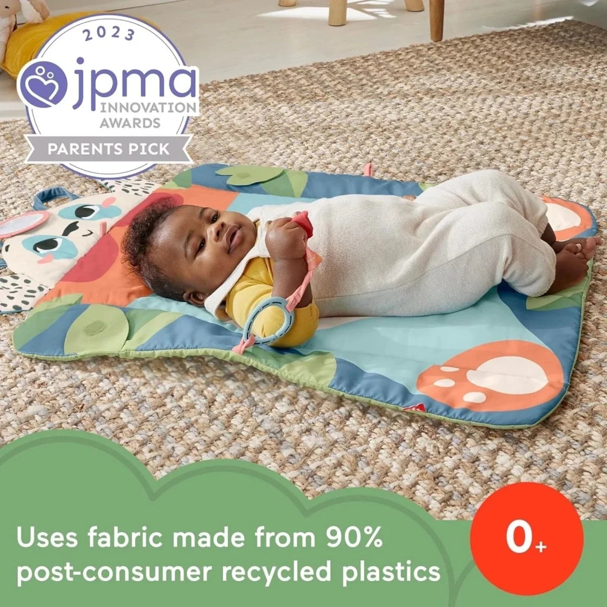 Baby playing on blue panda playmat with built-in toy links and soft panel