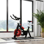 Black floor protector mat under a stationary exercise bike