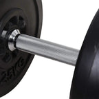 Textured silver knurled grip on a black barbell with weight plate on the end