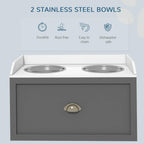 Grey raised dog feeding station with two stainless steel bowls and front storage drawer.