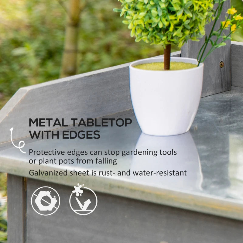 Grey potting table with metal tabletop and protective raised edges