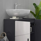 Light grey bathroom vanity cabinet with black countertop and open door storage compartment
