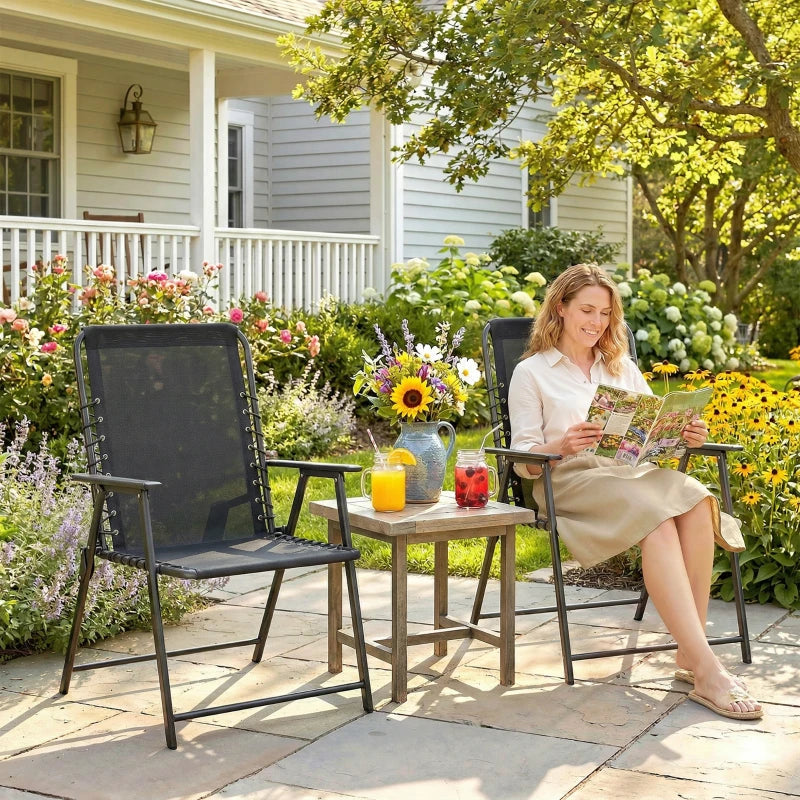 Black folding outdoor dining chairs with high back and armrests, patio styling