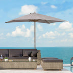 Light grey wooden table parasol open overhead with central pole for outdoor shade