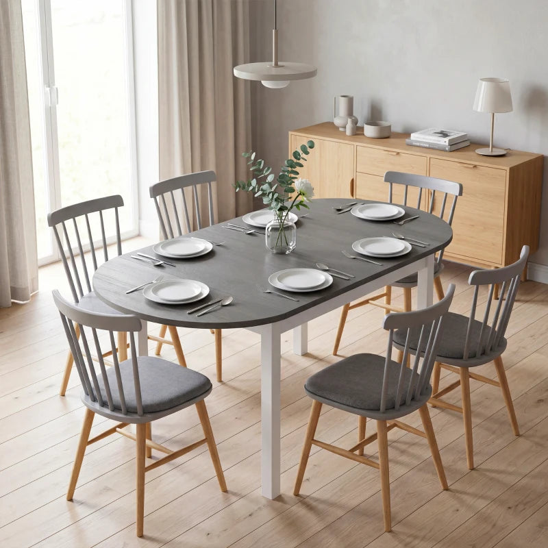 Grey drop-leaf dining table with white legs, large oval top for dining