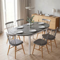 Grey drop-leaf dining table with white legs, large oval top for dining