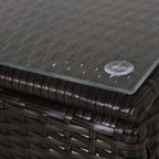 Brown rattan side table top with water-resistant woven surface and small water droplet