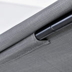 Close-up of grey sling cushion edge and black metal armrest on porch swing