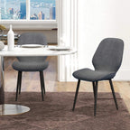 Grey velvet dining chair with curved backrest and black metal legs