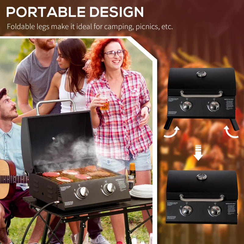 Black portable gas grill with open lid and folding legs; two burner control knobs