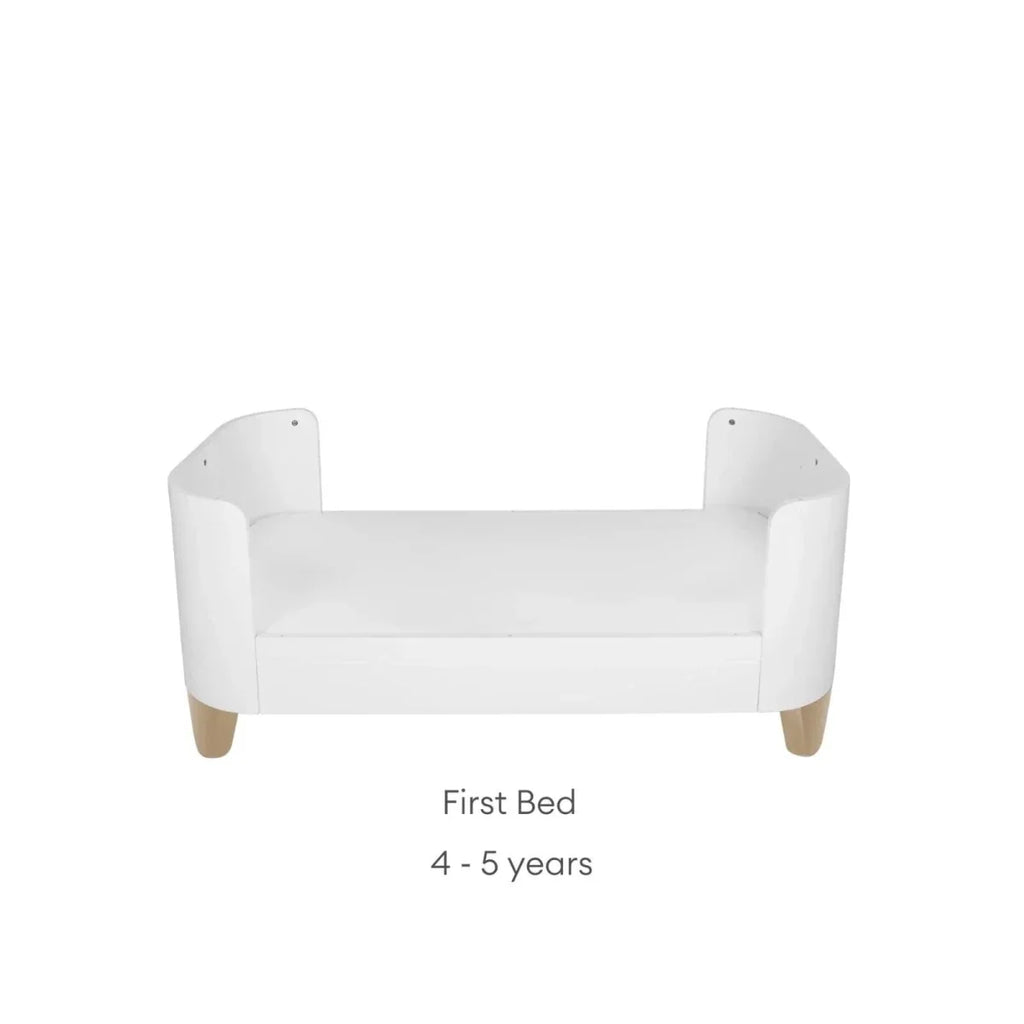 White first bed frame with side panels, rounded corners, and vertical safety slats