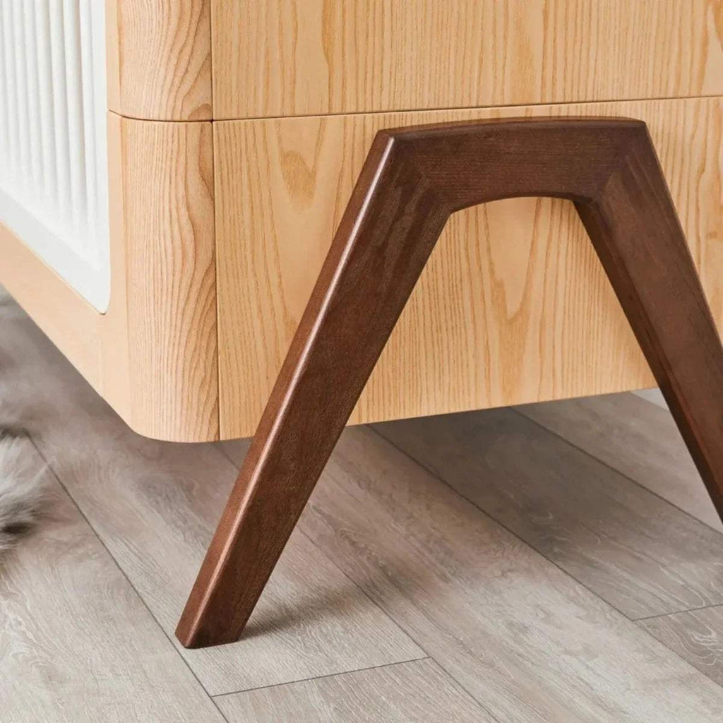 Dark wood cot bed leg under natural frame with white slats