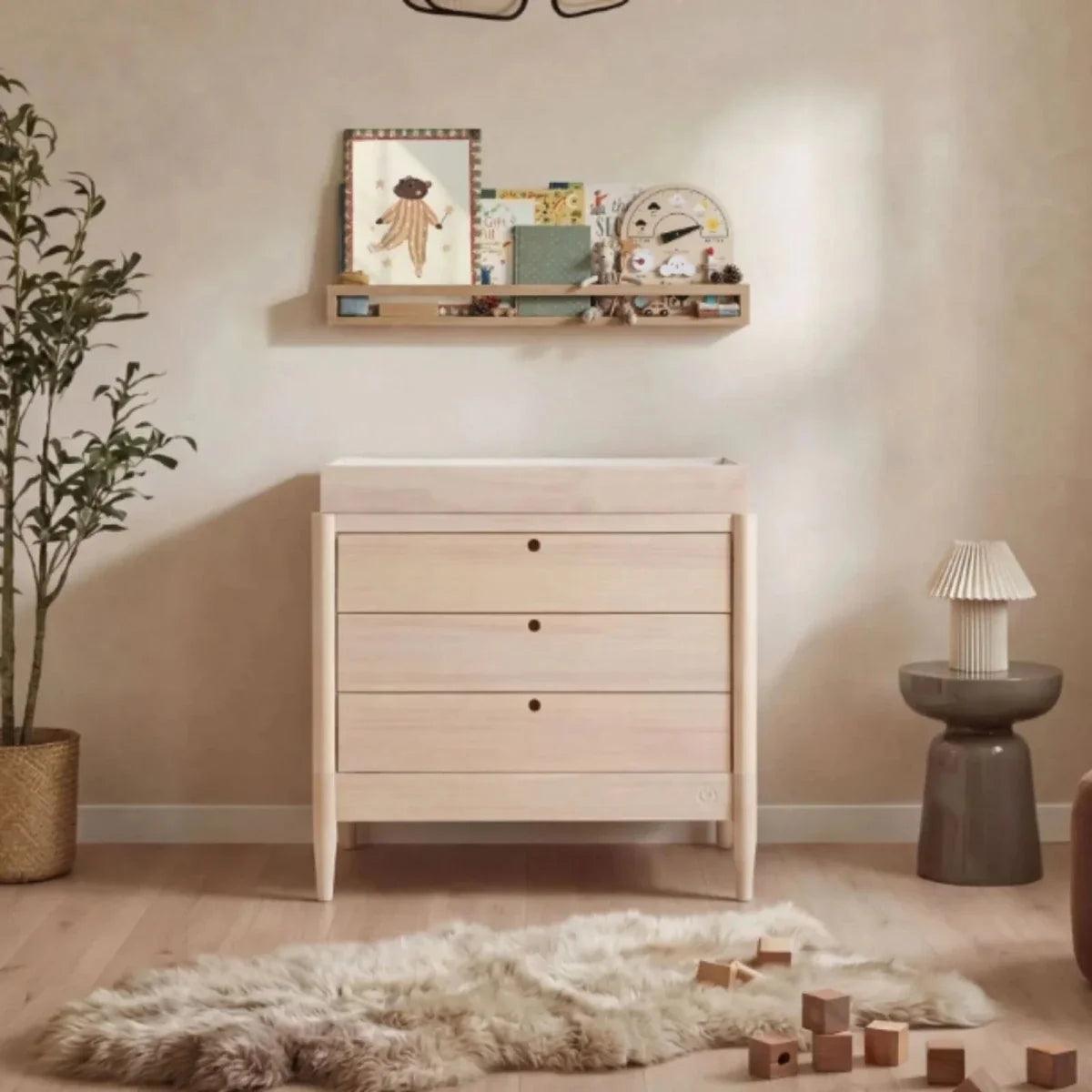 Natural ash baby dresser with three drawers and round knobs