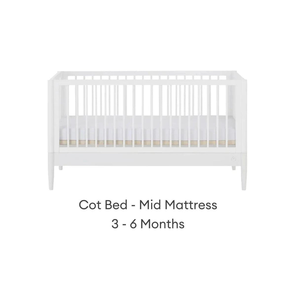 White cot bed with mid mattress height, front view