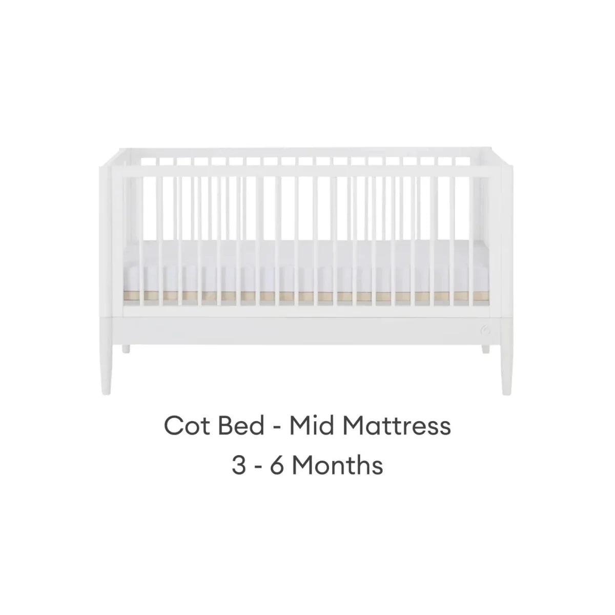 White cot bed with mid mattress height, front view
