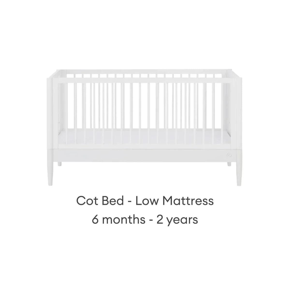 White cot bed with low mattress height, front view