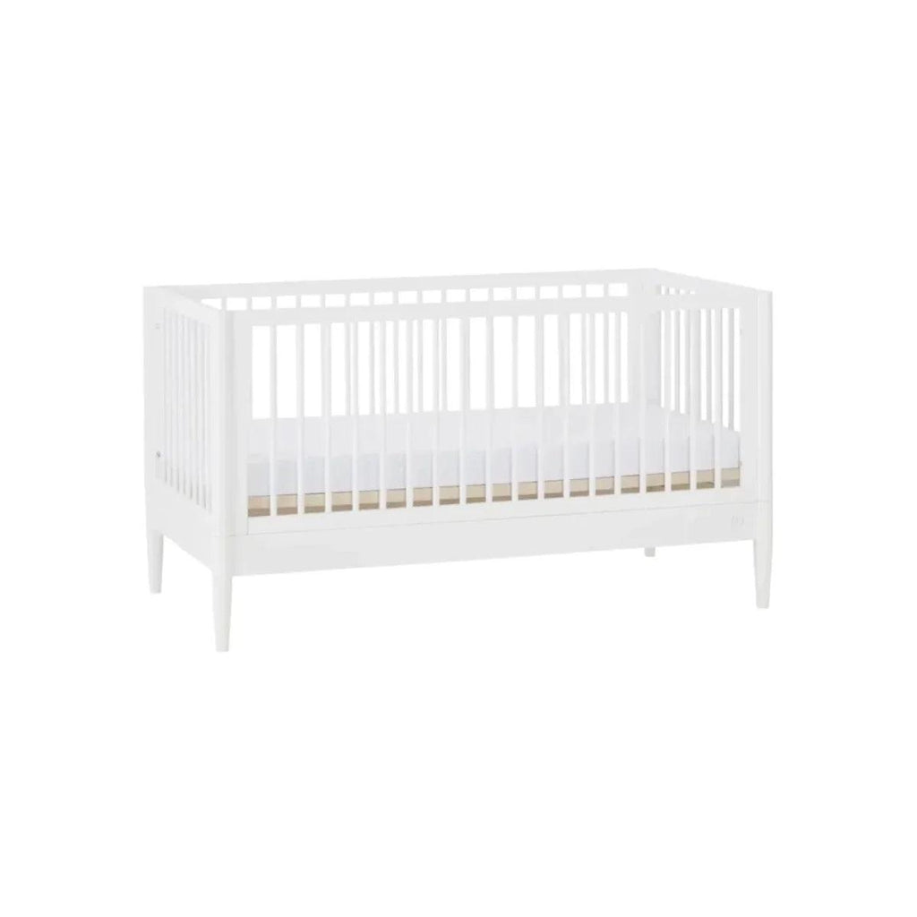 White cot bed with side rail slats, angled view